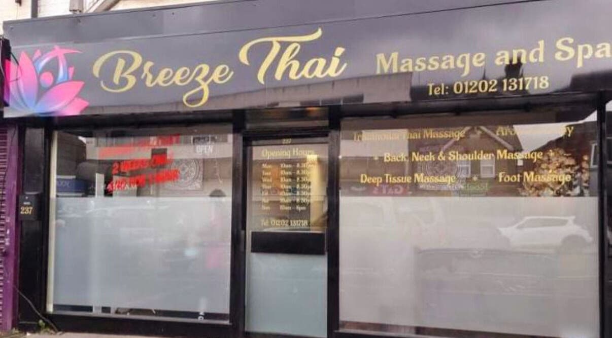 Front view of Breeze Thai Massage & Spa in Poole, England, GB with glass storefront and floral logo.