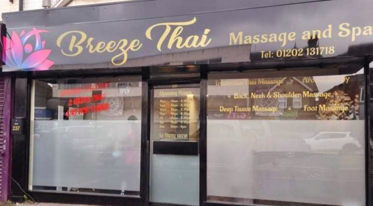 Front view of Breeze Thai Massage & Spa in Poole, England, GB with glass storefront and floral logo.