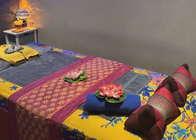 Colorful massage room at Breeze Thai Massage & Spa in Poole, England, GB, showcasing relaxation and elegance.