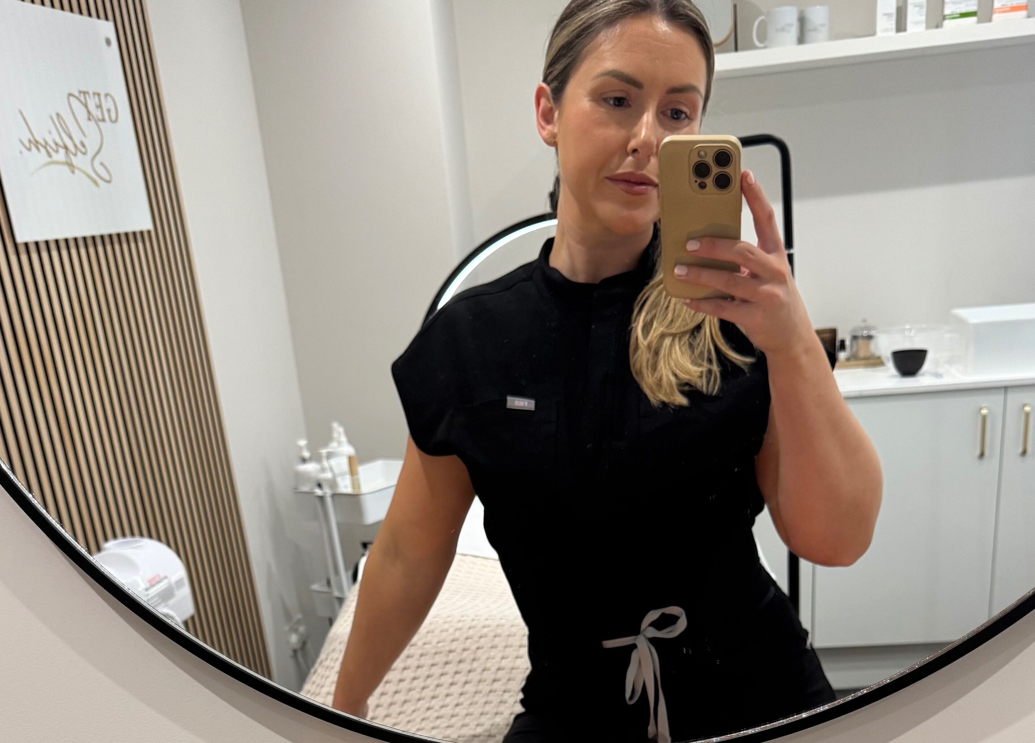 Professional at Get Selfish Skin Clinic, Stebbing, England, GB, in a calming treatment room.