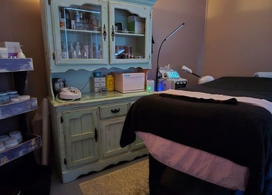 Relaxing treatment room at Treat Yourself Beautifully, Clermont, Queensland, AU with cozy bed and elegant decor.