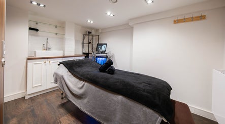 Effulgent Beauty treatment room in London, United Kingdom, GB featuring massage and hydrafacial services.