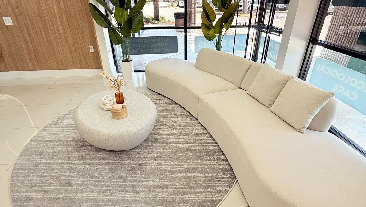 Chic waiting area in BG Studio Salon, Coconut Creek, Florida, US with modern sofa and decor.