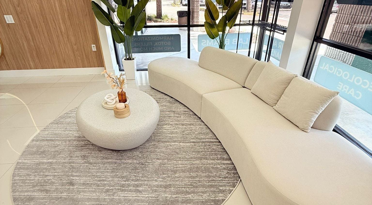 Chic waiting area in BG Studio Salon, Coconut Creek, Florida, US with modern sofa and decor.