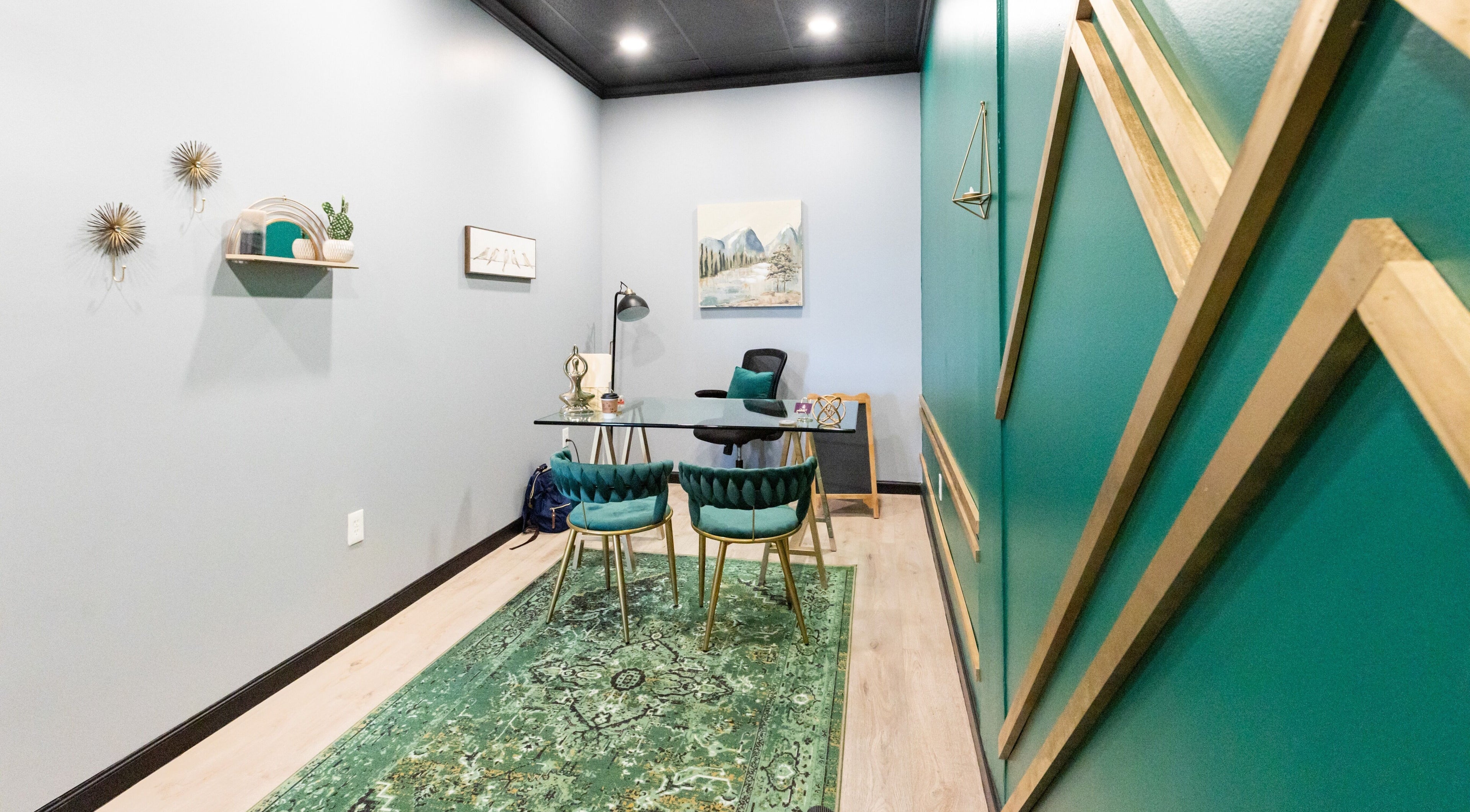 Serene office at Aura Holistic and Metaphysical Wellness, Spring, Texas, US with green decor and modern furnishings.