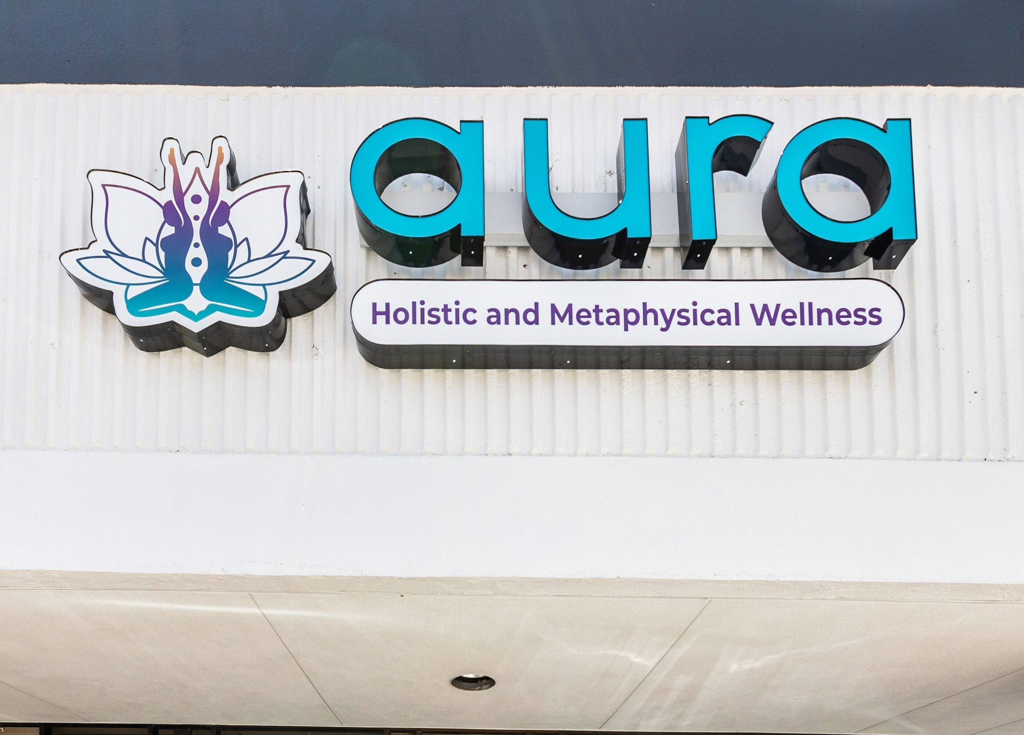 Exterior sign of Aura Holistic and Metaphysical Wellness in Spring, Texas, US.