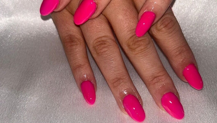 Bright pink manicured nails from The Hair & Beauty Hub, Bargeddie, Scotland, GB.
