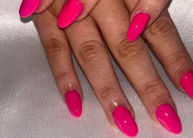 Bright pink manicured nails from The Hair & Beauty Hub, Bargeddie, Scotland, GB.