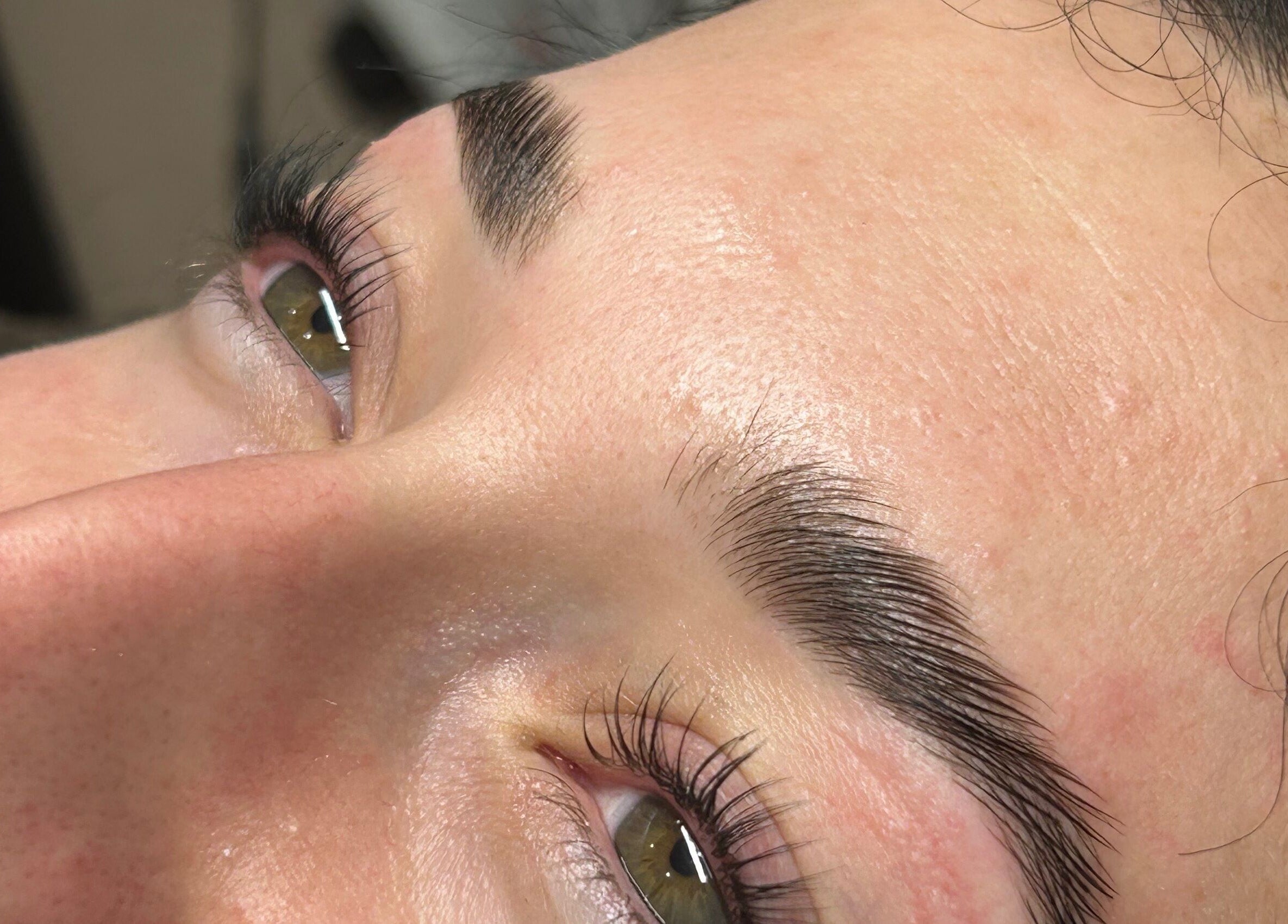 Close-up of perfectly shaped brows at Aleestheticss, Laval, Québec, CA, showcasing professional eyebrow care.