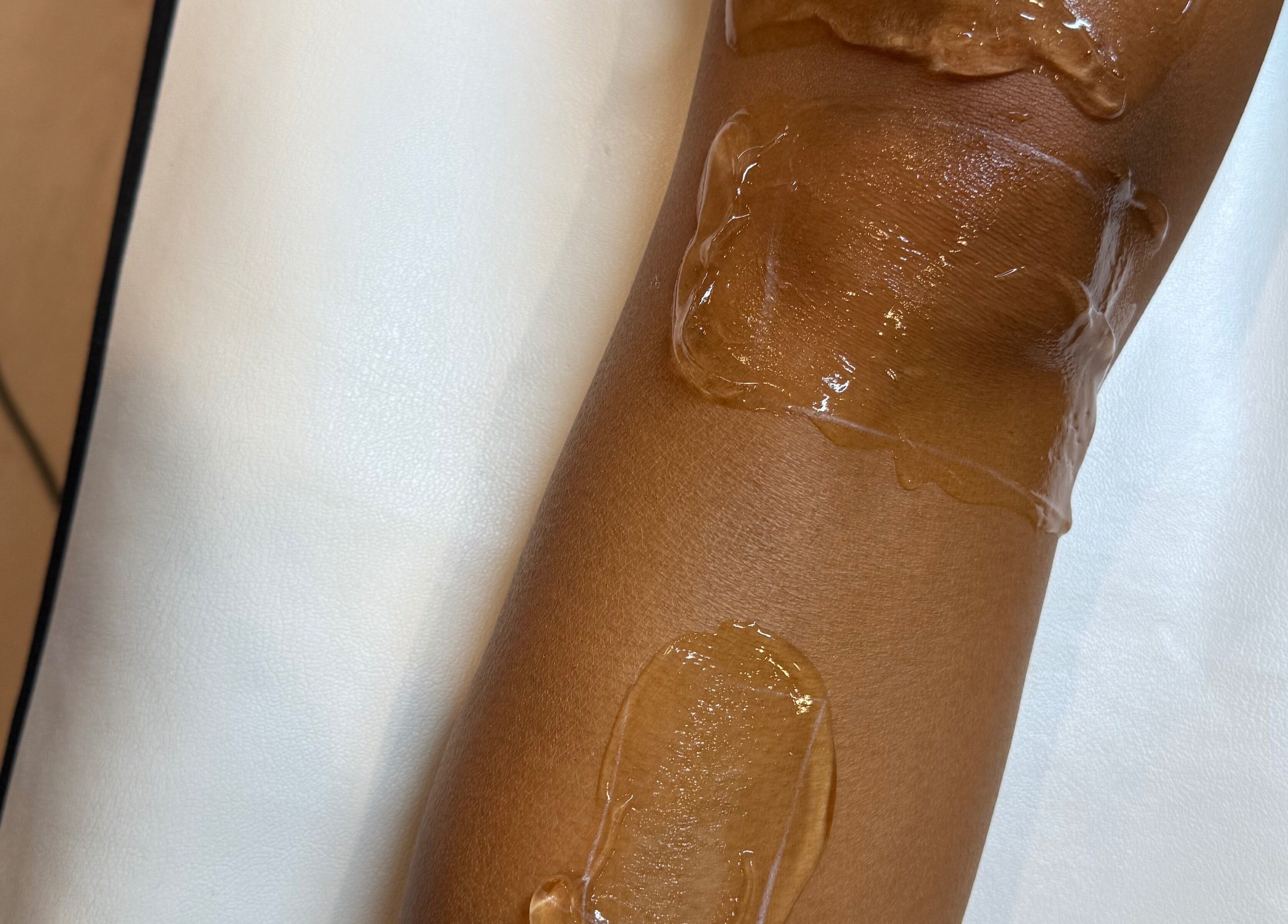 Wax treatment in progress at Aleestheticss, Laval, Québec, CA, showcasing silky smooth skin.