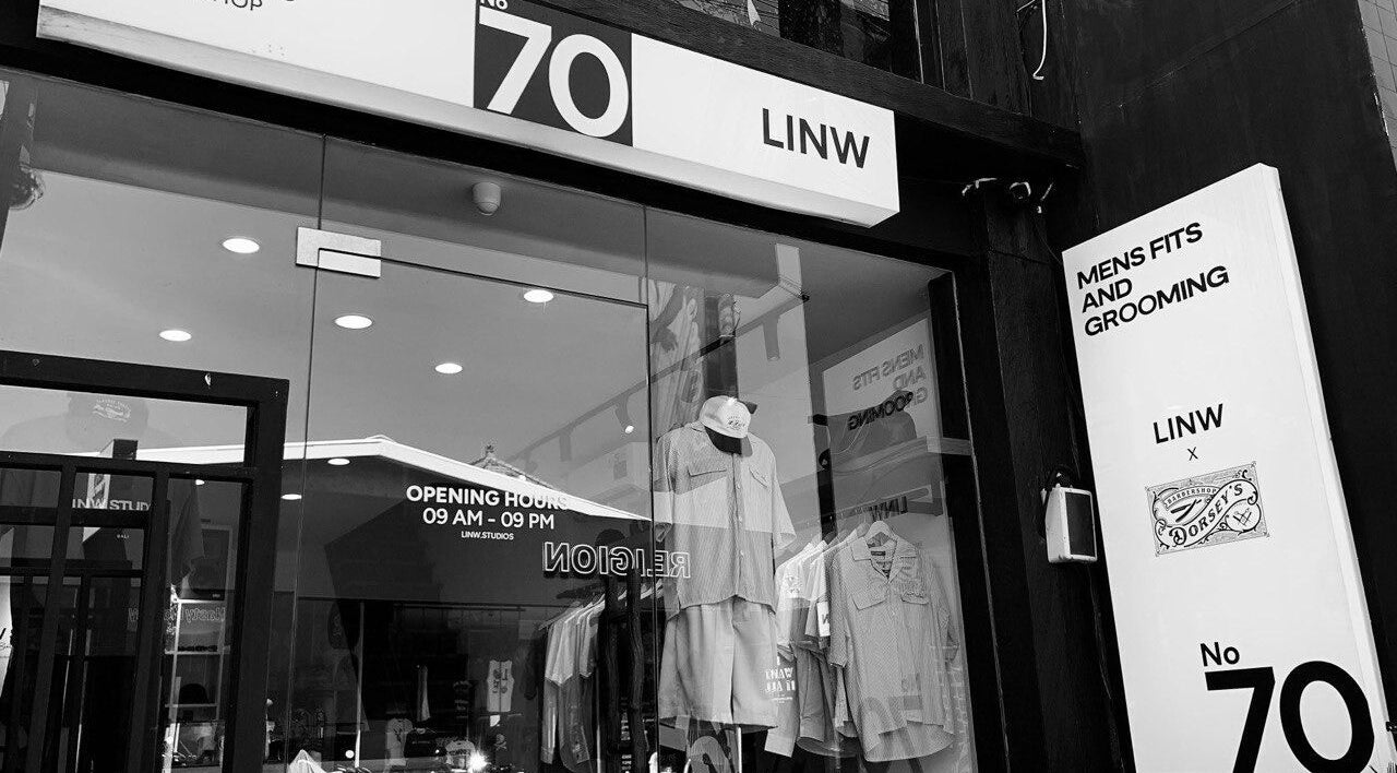 Entrance of Dorsey's Barber Shop at Canggu, Bali, showcasing stylish men's apparel.