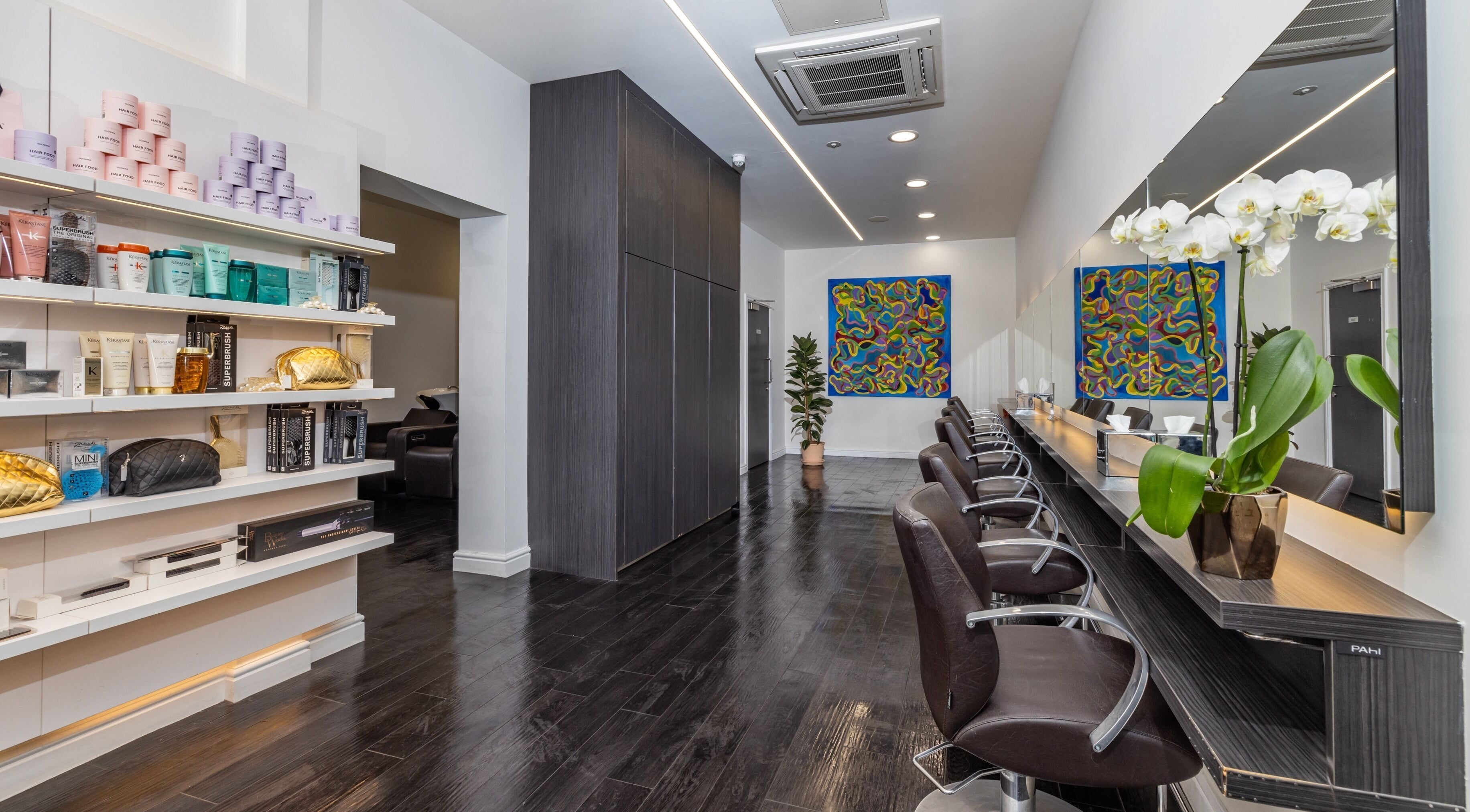 Sleek, modern interior of Daniels beauty salon in London, England, GB, showcasing luxury products and stylish seating.