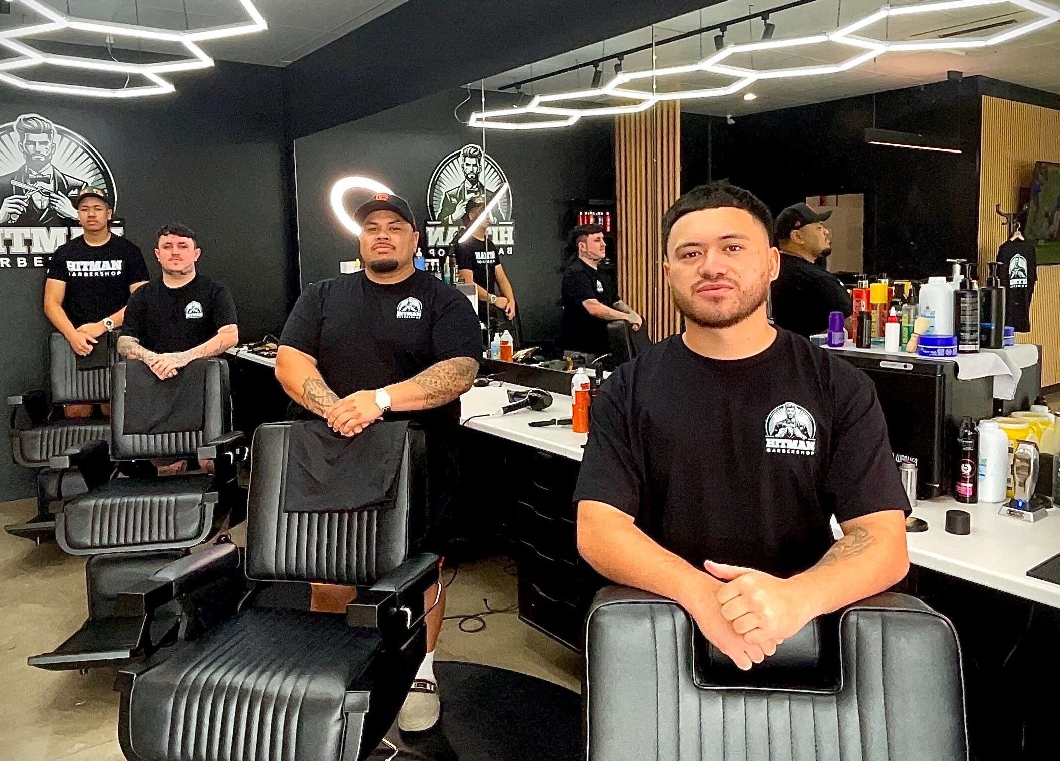 Hitman Barbershop team in Yarrabilba, Queensland. Modern interior with skilled barbers.