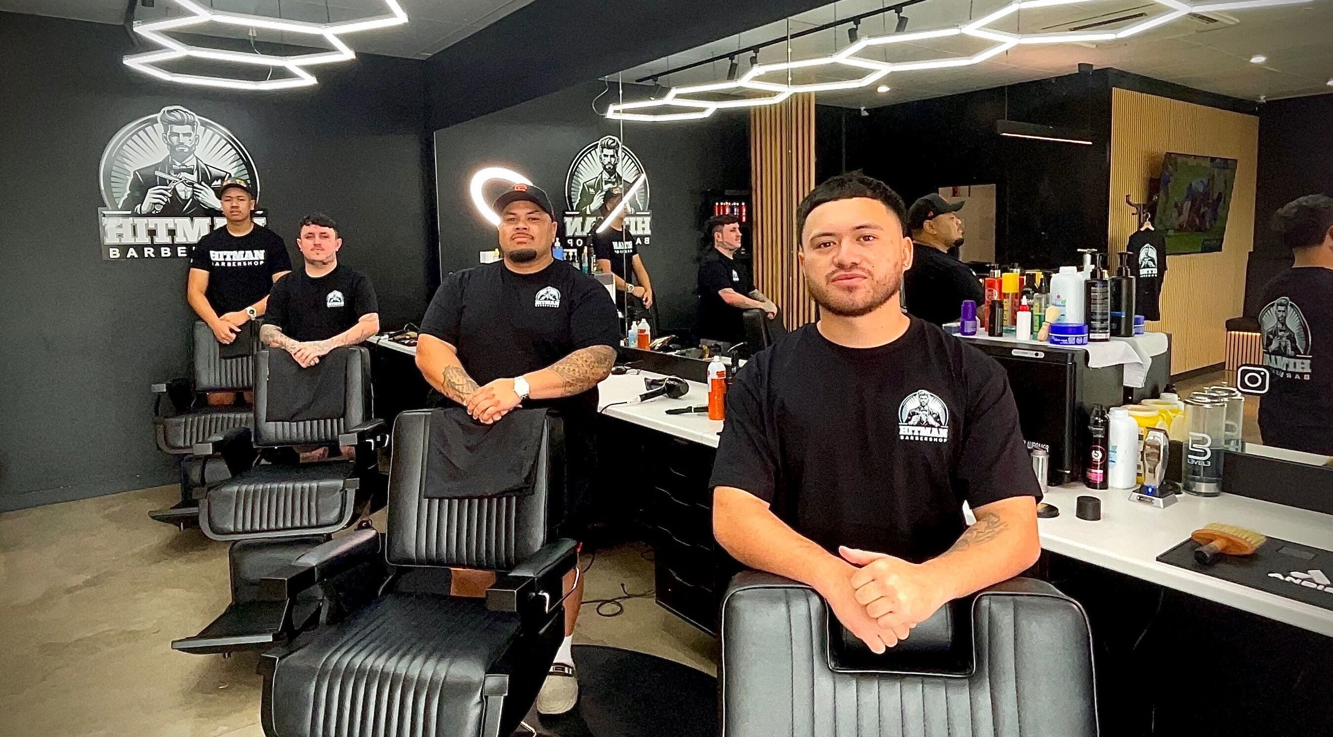 Hitman Barbershop team in Yarrabilba, Queensland. Modern interior with skilled barbers.