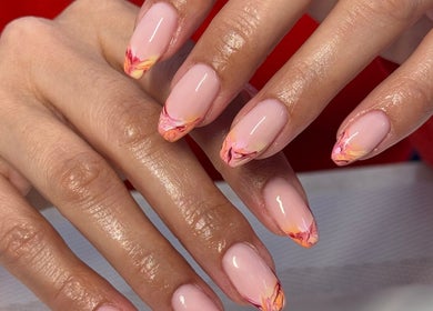 Elegant nail art at Gels By Kayles, Taunton, England, GB. Featuring a pink base with vibrant patterns.