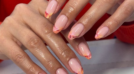 Elegant nail art at Gels By Kayles, Taunton, England, GB. Featuring a pink base with vibrant patterns.