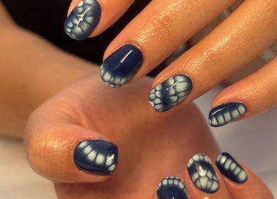 Stylish marbled nails by Gels By Kayles, Taunton, England, GB showcasing blue and white design.