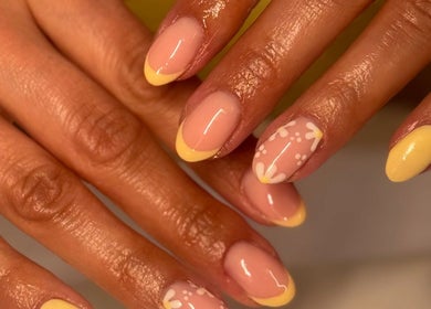 Stylish yellow floral nail design at Gels By Kayles, Taunton, England, GB.
