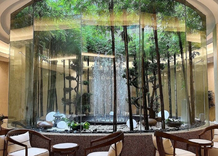 Elegant seating area with a bamboo garden and fountain at JM Beauty Studio, Kuala Lumpur, Wilayah Persekutuan Kuala Lumpur, MY.