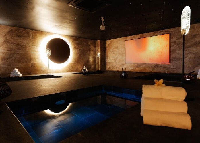 Luxurious spa room at JM Beauty Studio in Kuala Lumpur, with warm lighting and tranquil ambiance.
