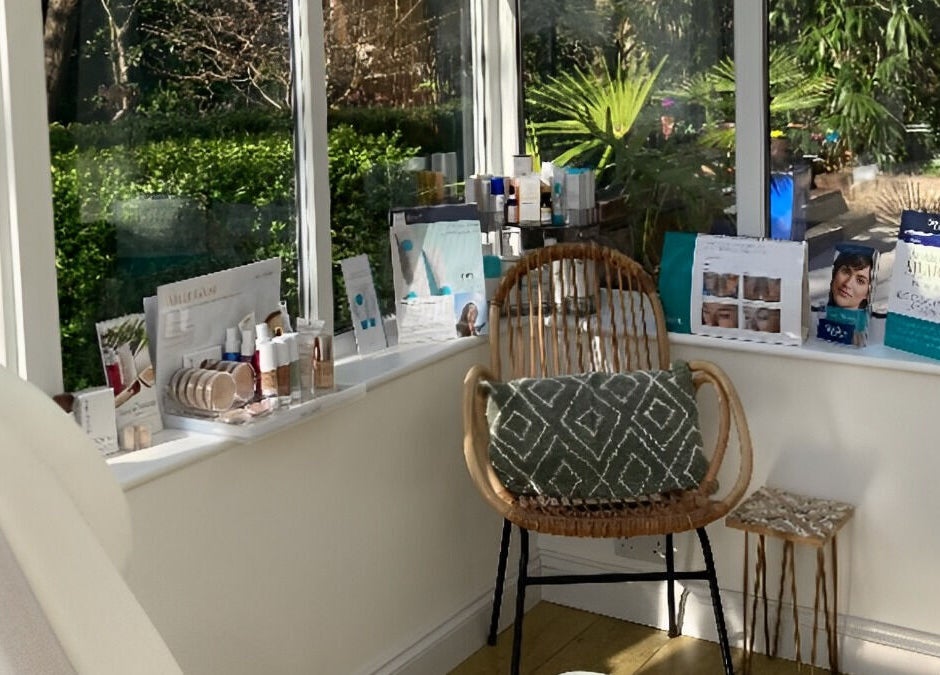Cozy corner at Natural Beauty Aesthetics - Worcester Home Clinic in Fernhill Heath, England, with beauty products.