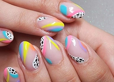 Colorful nail art design at Mooi Getooi, Douglas, Northern Cape, ZA, showcasing vibrant patterns.