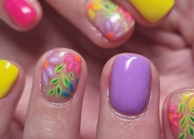 Colorful floral nail art at Mooi Getooi, Douglas, Northern Cape, ZA. Showcasing vibrant manicure designs.