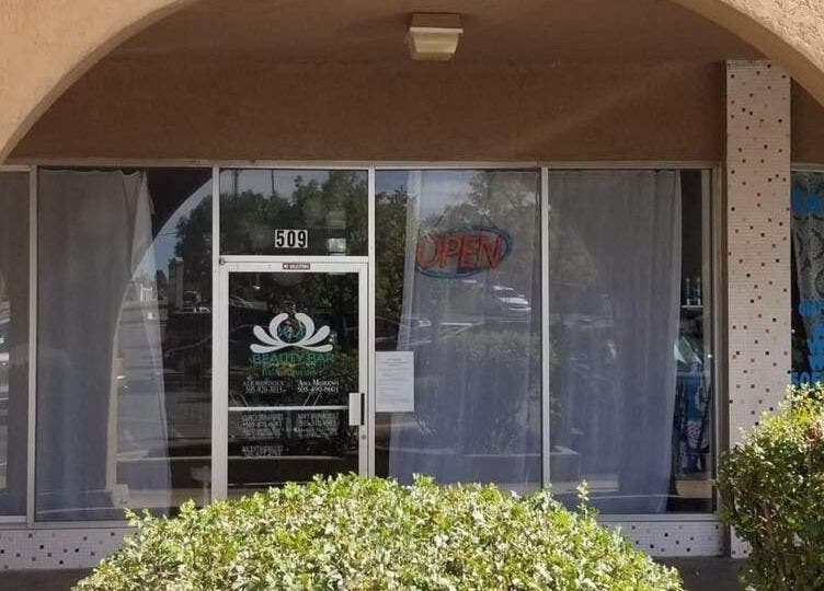 Front entrance of A&A Beauty Bar Llc in Santa Fe, New Mexico, US, with an open sign visible.