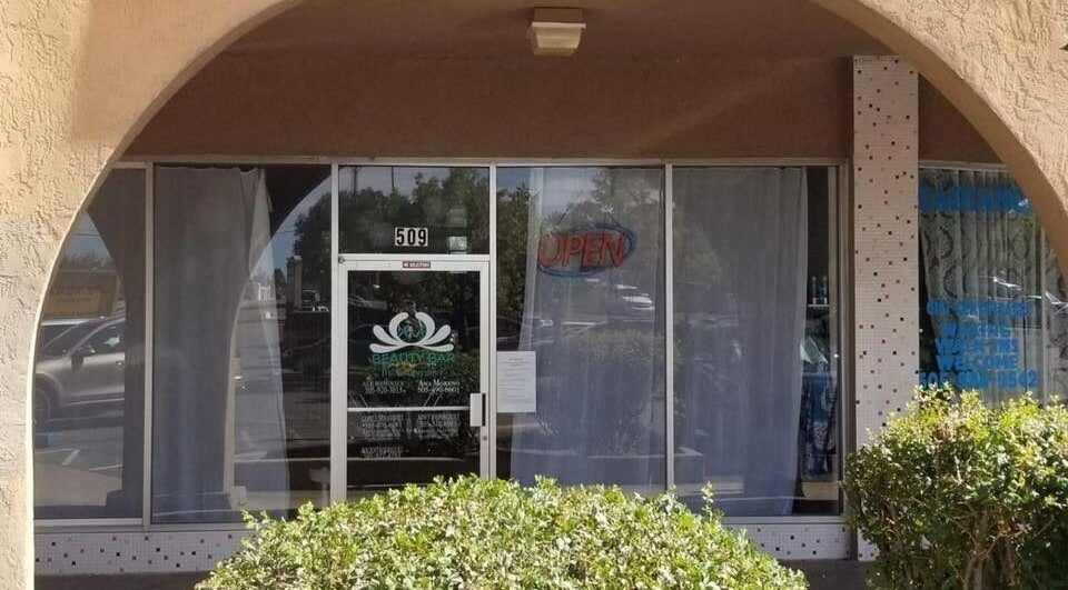 Front entrance of A&A Beauty Bar Llc in Santa Fe, New Mexico, US, with an open sign visible.