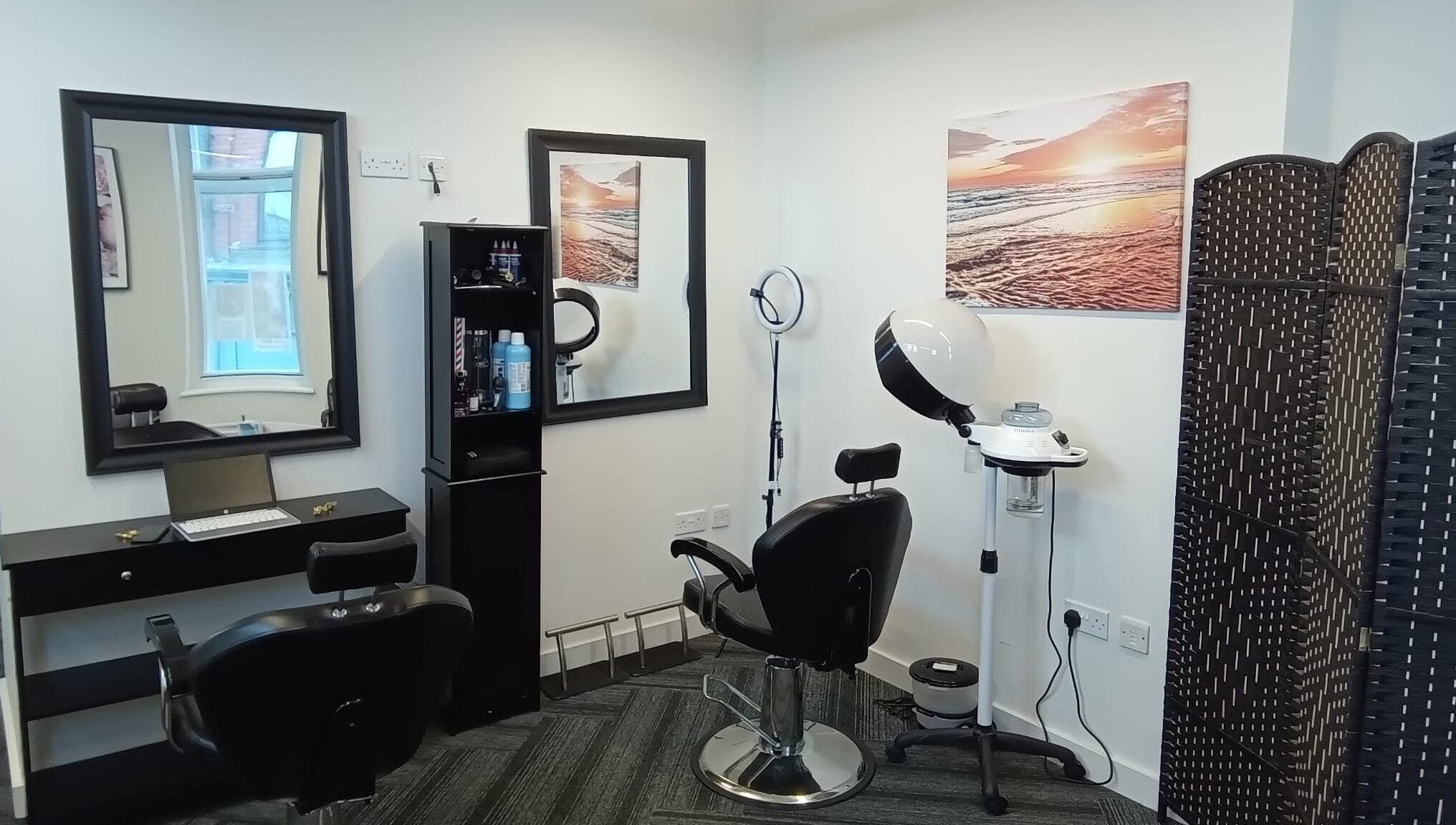 Elegant salon interior with styling chairs at Lovenish Hair and Beauty Salon, Newport, Wales, GB.