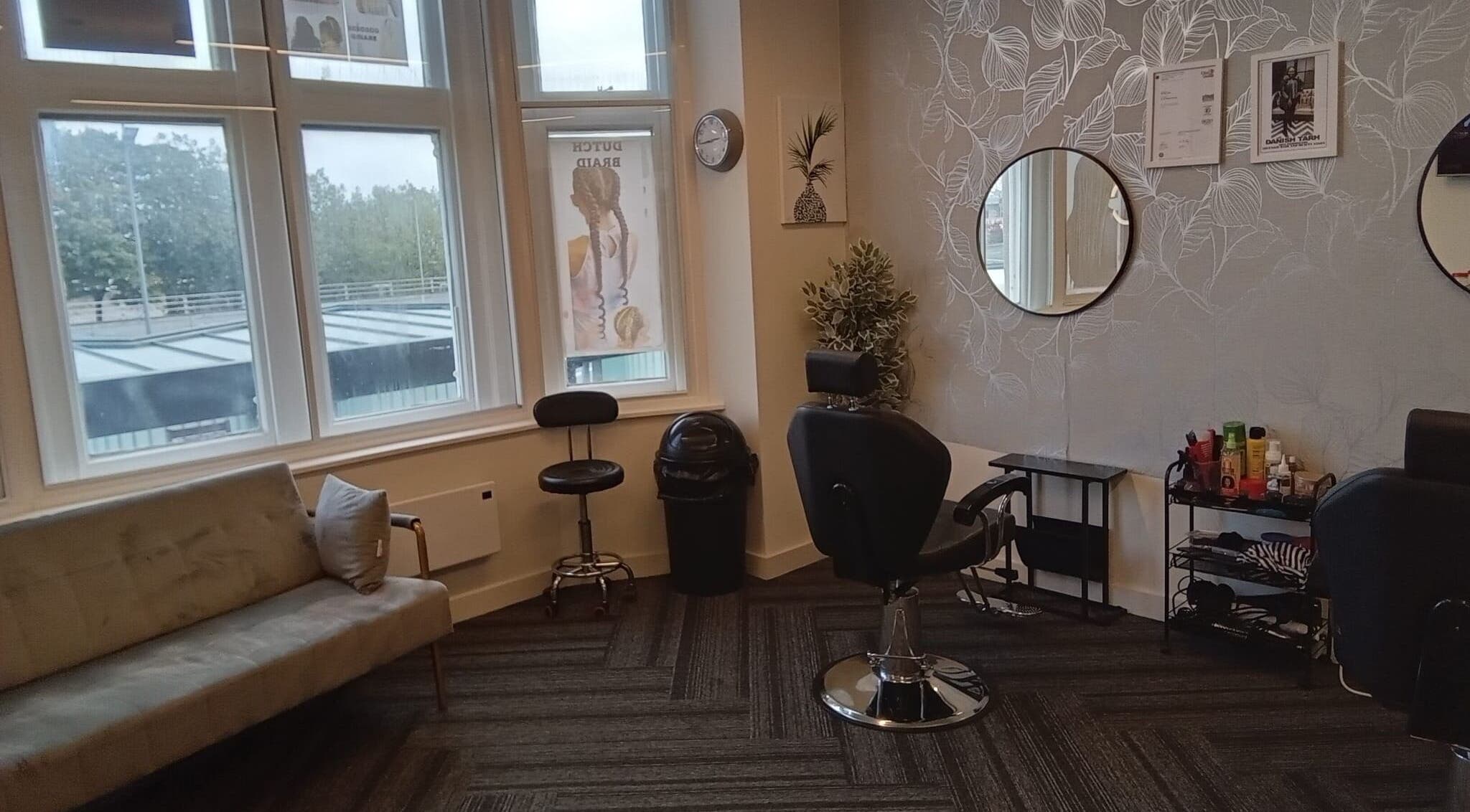 Chic interior of Lovenish Hair and Beauty Salon, Newport, Wales, GB with stylish seating and decor.