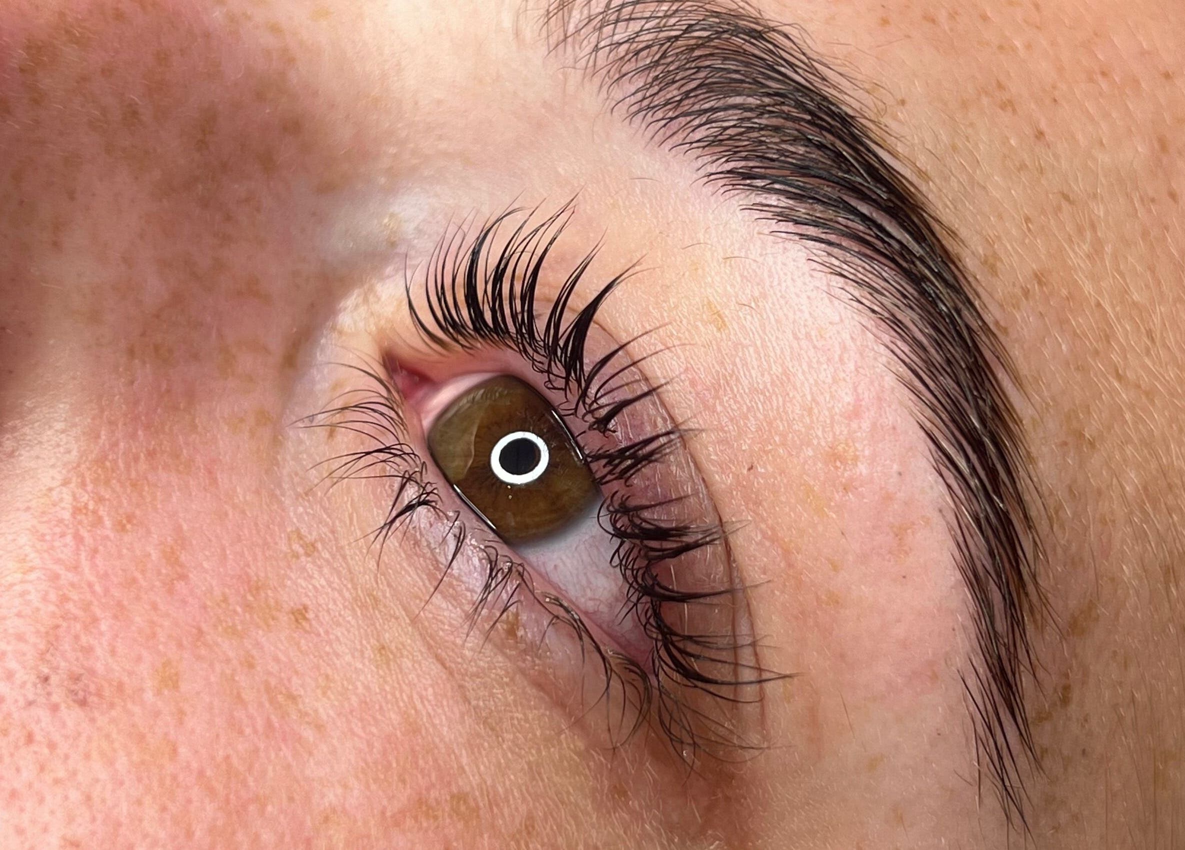 Close-up of a beautifully groomed eyebrow and eyelashes at Vienna Aesthetics, Reigate, England, GB.