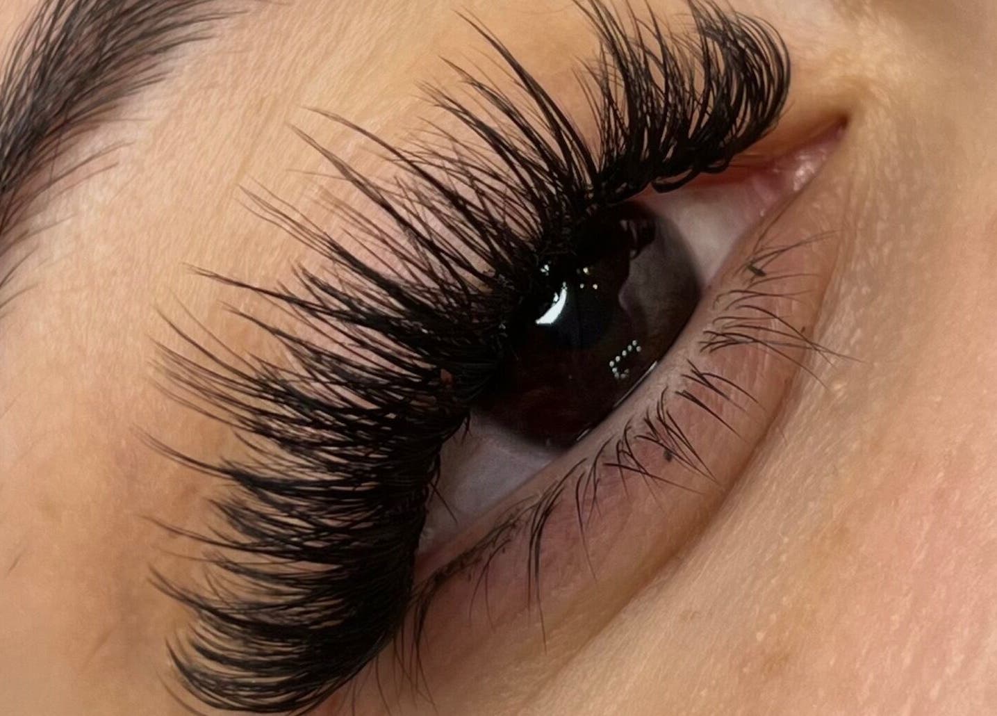 Close-up of beautifully enhanced eyelashes at Vienna Aesthetics, Reigate, England, GB.