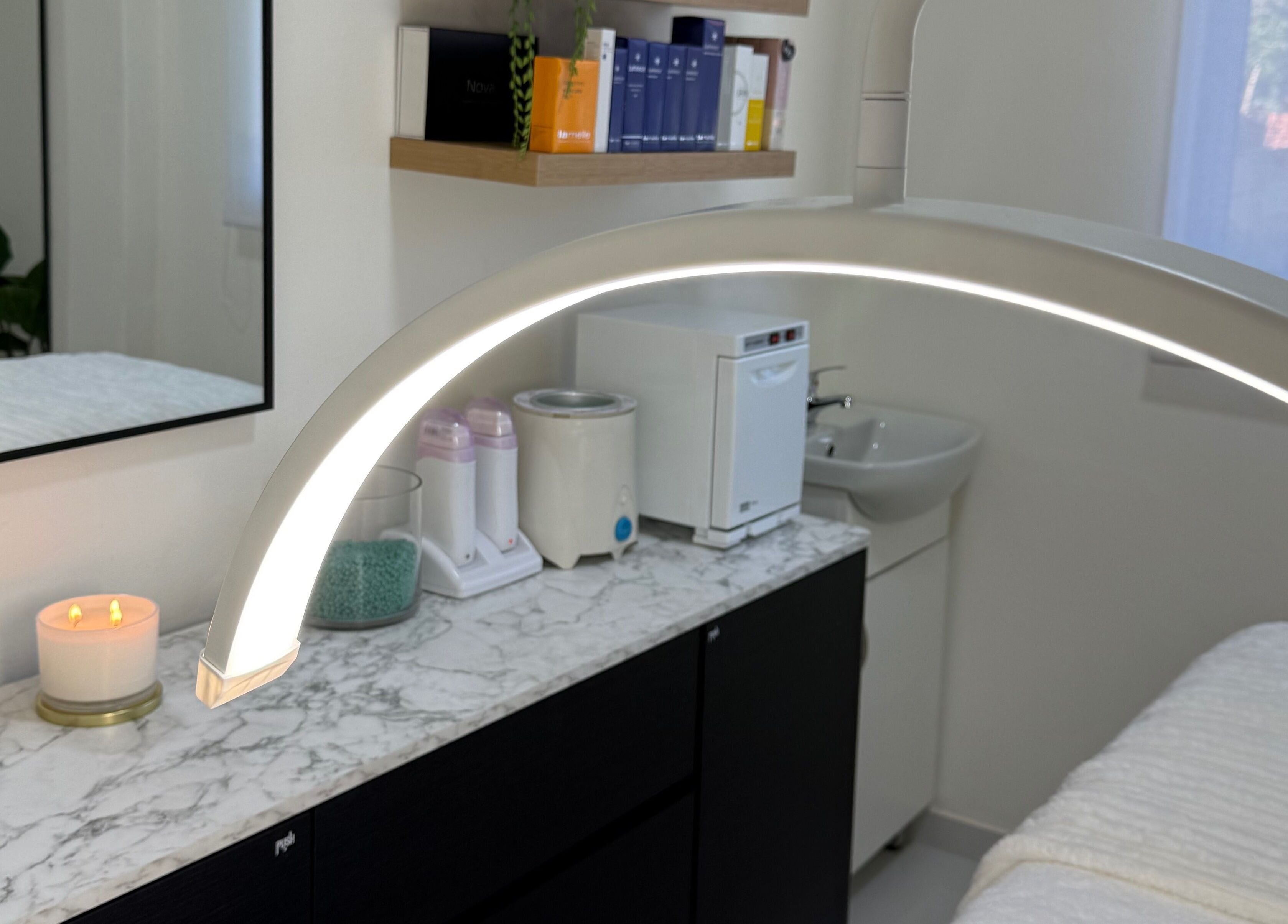 Tranquil treatment room at Studio XO La Lucia, Durban North, featuring modern equipment and candles.