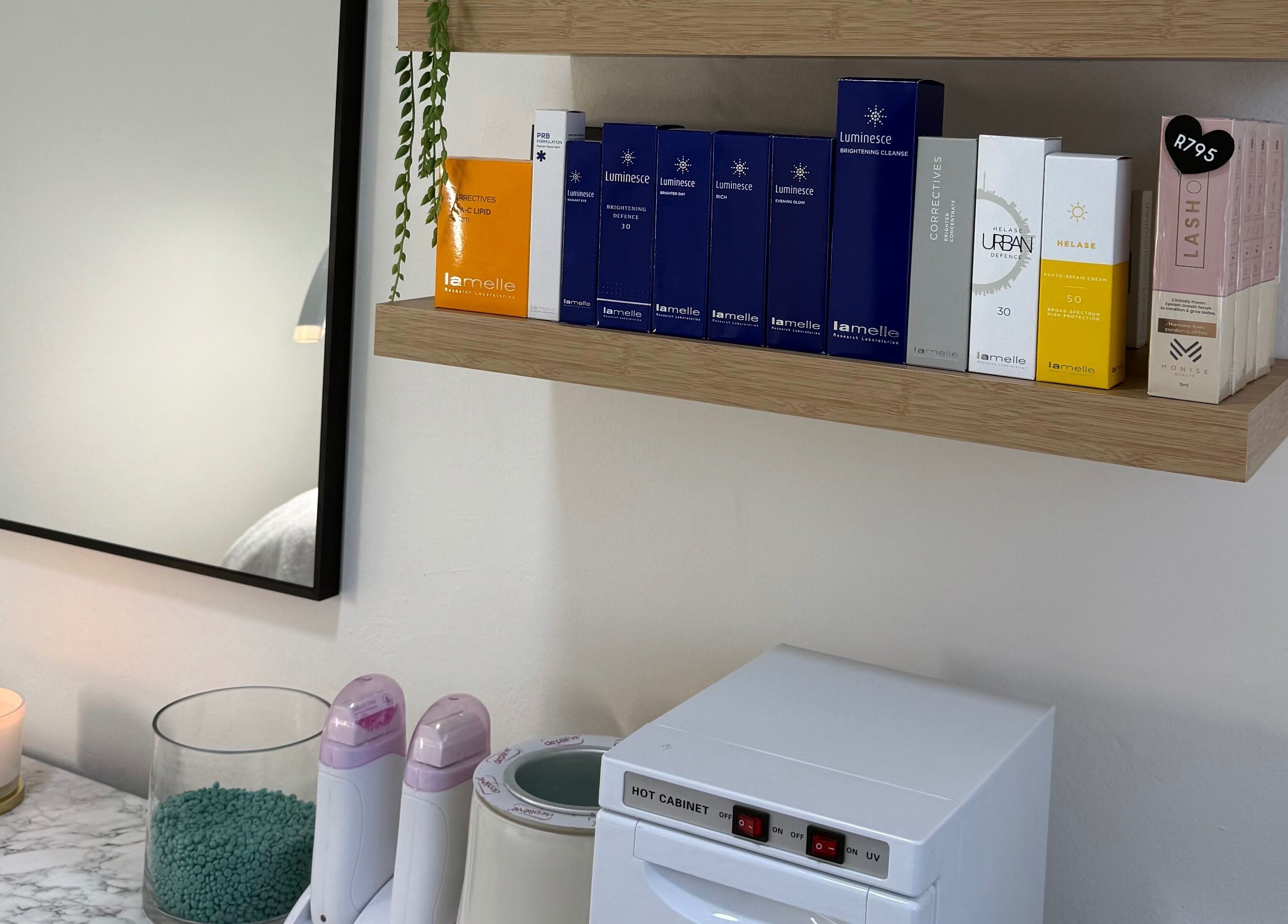 Beauty products on shelves at Studio XO La Lucia, Durban North, Kwazulu-natal, ZA, enhancing the spa's elegance.