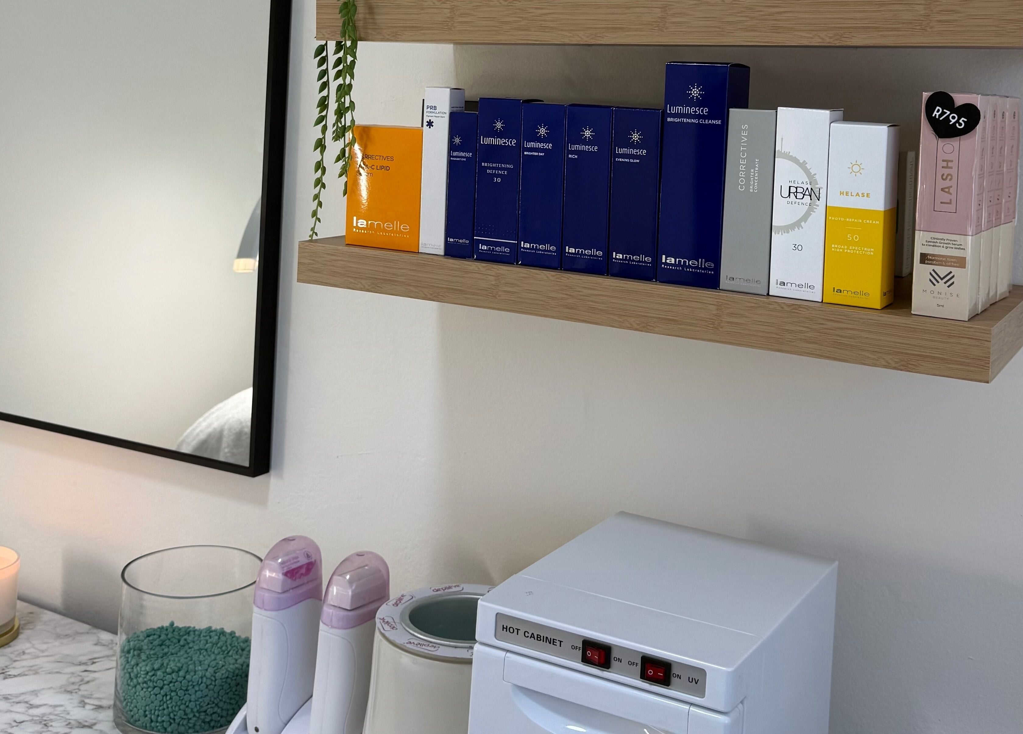 Beauty products on shelves at Studio XO La Lucia, Durban North, Kwazulu-natal, ZA, enhancing the spa's elegance.