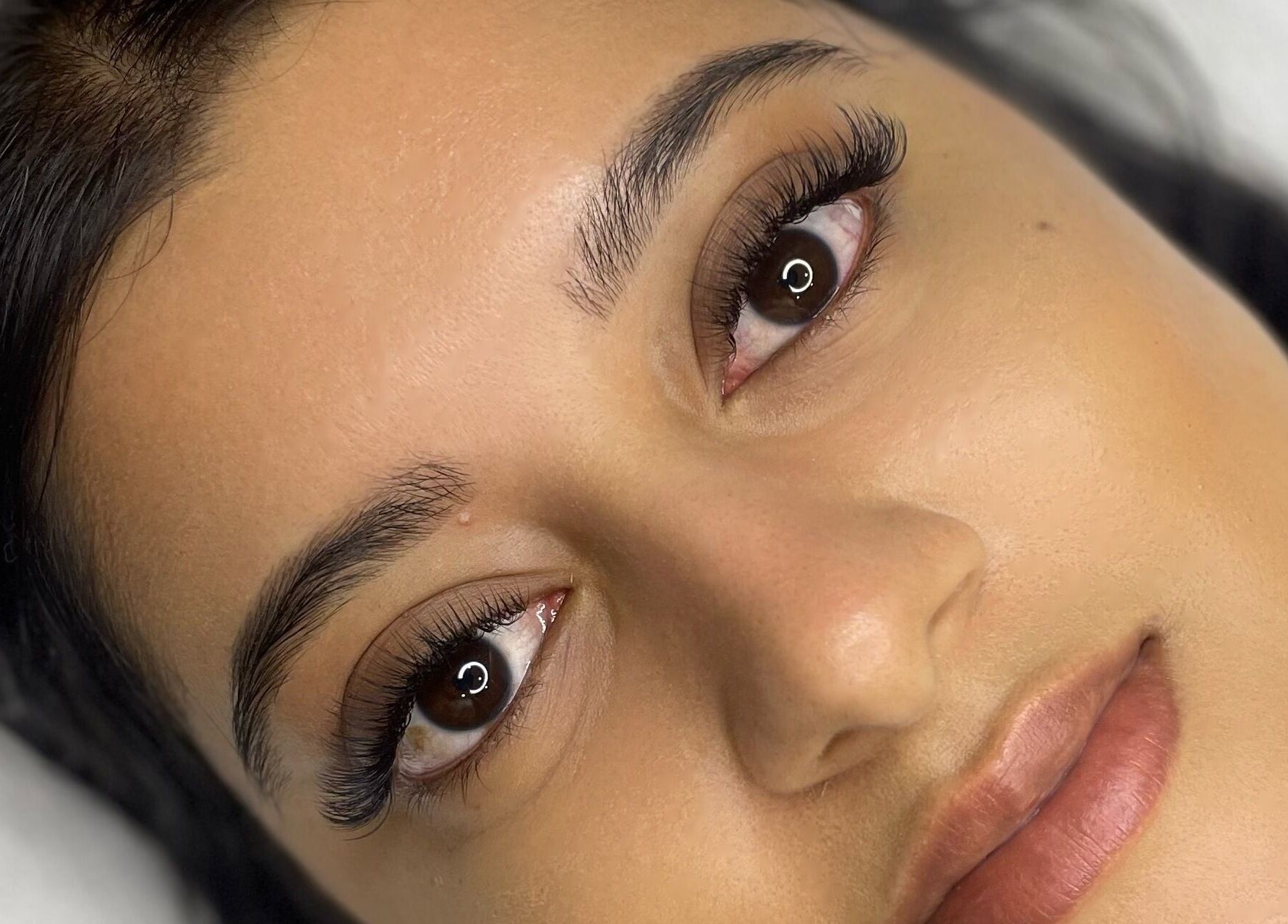 Close-up of a woman's face showcasing expertly applied eyelash extensions at Studio XO La Lucia, Durban North, Kwazulu-natal, ZA.
