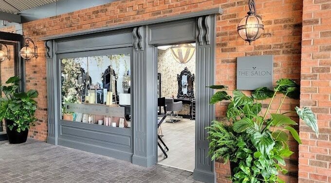 Chic exterior of The Salon in Tamworth, England, GB with stylish decor and lush greenery.