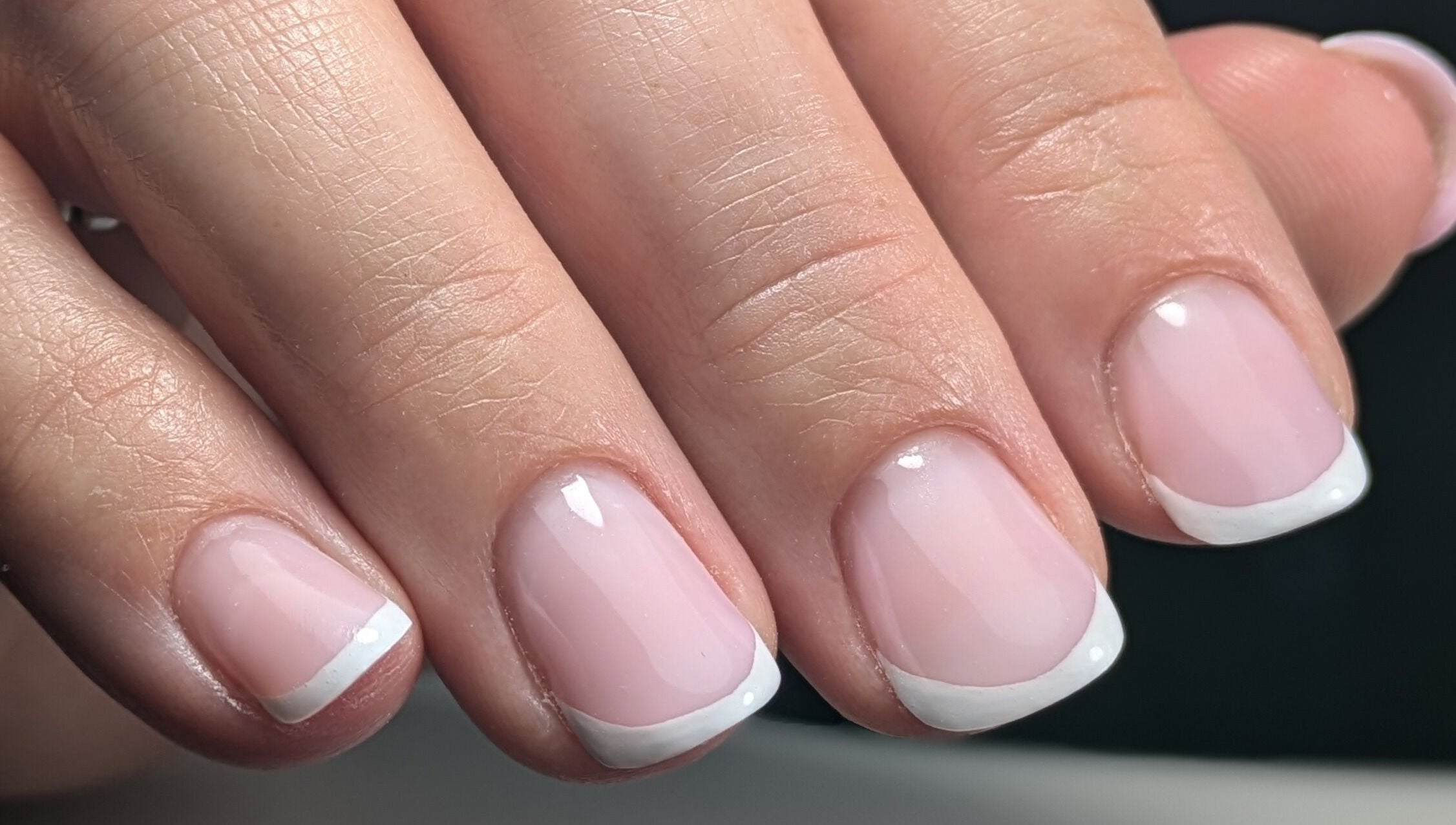 Chic French manicure at AS Nail Studio Peterborough, Peterborough, England, GB showcasing elegance and style.