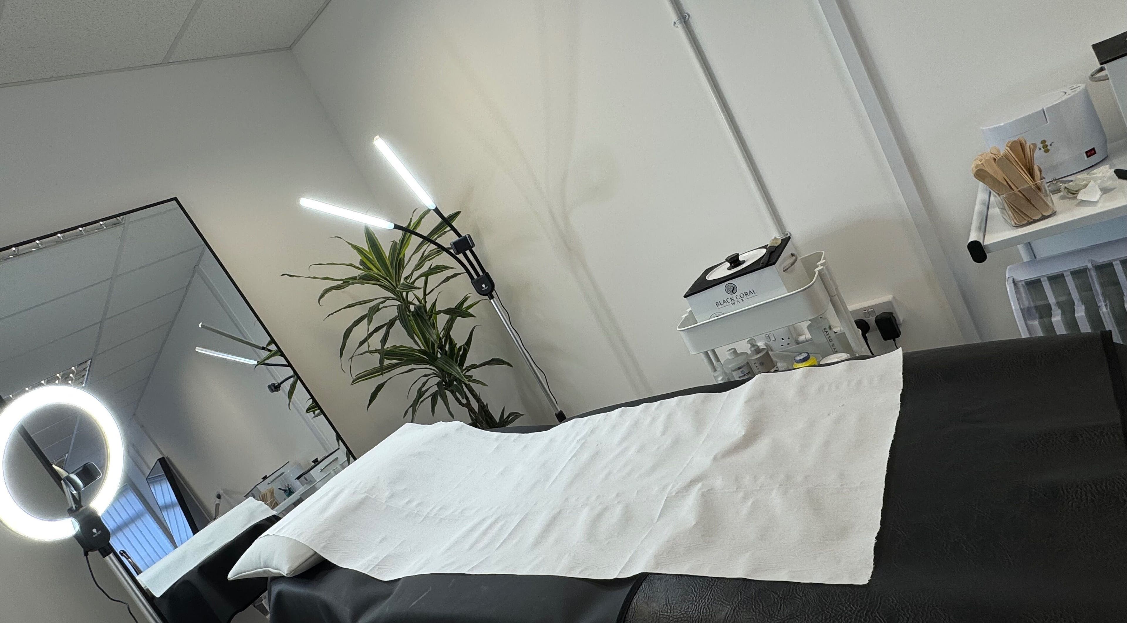 Modern waxing treatment room at Waxing Forbes No.2, Plymouth, England, GB with cozy setup.