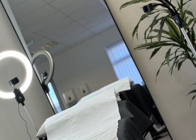 Comfortable treatment area at Waxing Forbes No.2, Plymouth, England, GB, featuring a modern setup and greenery.
