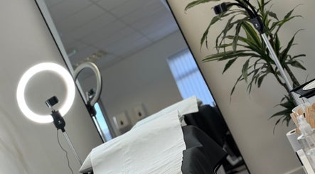 Comfortable treatment area at Waxing Forbes No.2, Plymouth, England, GB, featuring a modern setup and greenery.