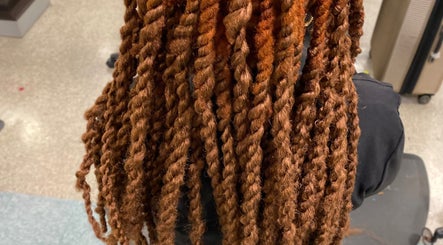 Stylish brown twists hairstyle at Platinum's Beauty Studio in Burlington, North Carolina, US.