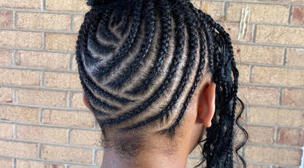 Artistic braided hairstyle at Platinum's Beauty Studio, Burlington, North Carolina, US.