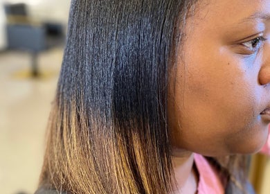 Straight and glossy hair at Platinum's Beauty Studio, Burlington, North Carolina, US.