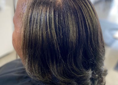 Smooth, styled hair at Platinum's Beauty Studio in Burlington, North Carolina, US salon.