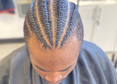 Intricate braids styled at Platinum's Beauty Studio, Burlington, North Carolina, US.