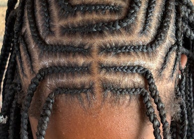 Intricate braided hairstyle at Platinum's Beauty Studio, Burlington, North Carolina, US