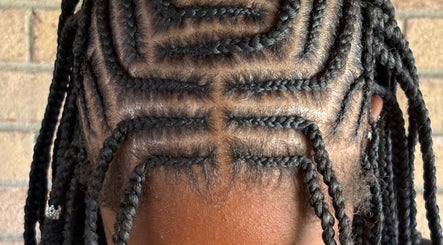 Intricate braided hairstyle at Platinum's Beauty Studio, Burlington, North Carolina, US.