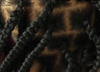 Intricate braids styled at Platinum's Beauty Studio, Burlington, North Carolina, US.